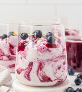 blueberry fool made with blueberry purée swirled into sweetened whipped cream and served in individual glasses