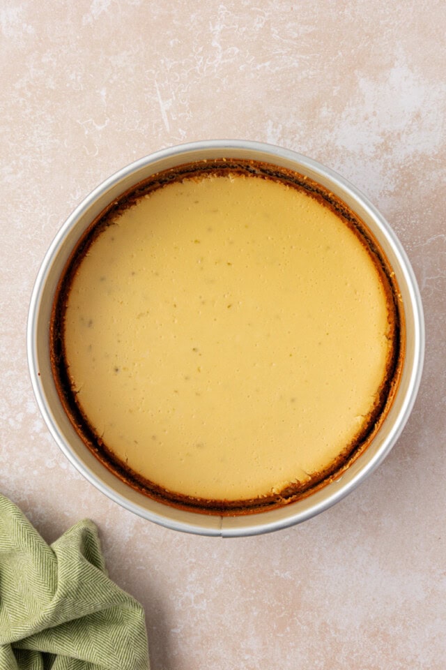 overhead view of freshly baked Key lime cheesecake in a springform pan