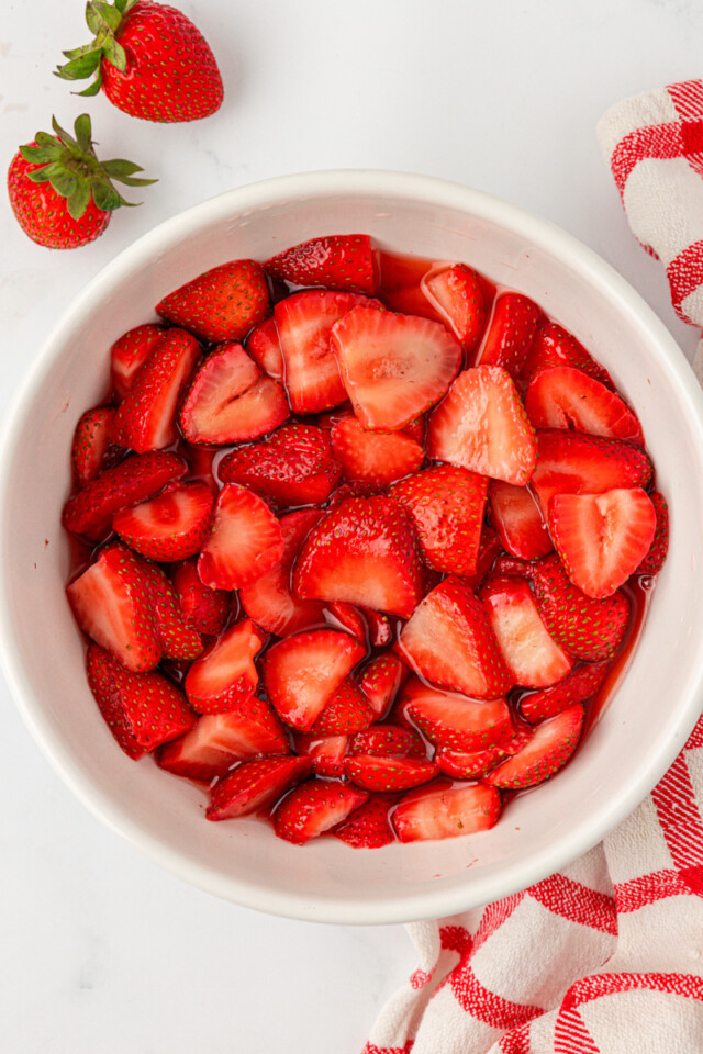 macerated strawberries in a white bowl