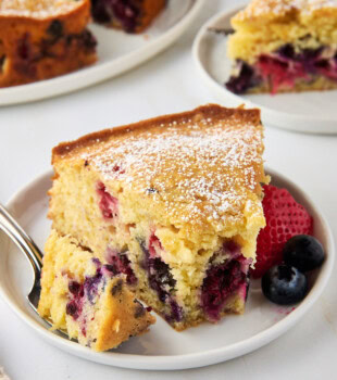 a slice of berry muffin cake filled with fresh berries
