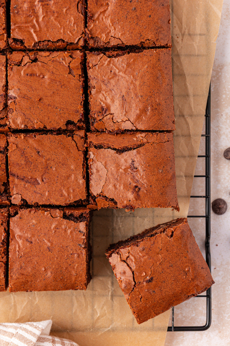 overhead view of sliced brown butter brownies on parchment paper
