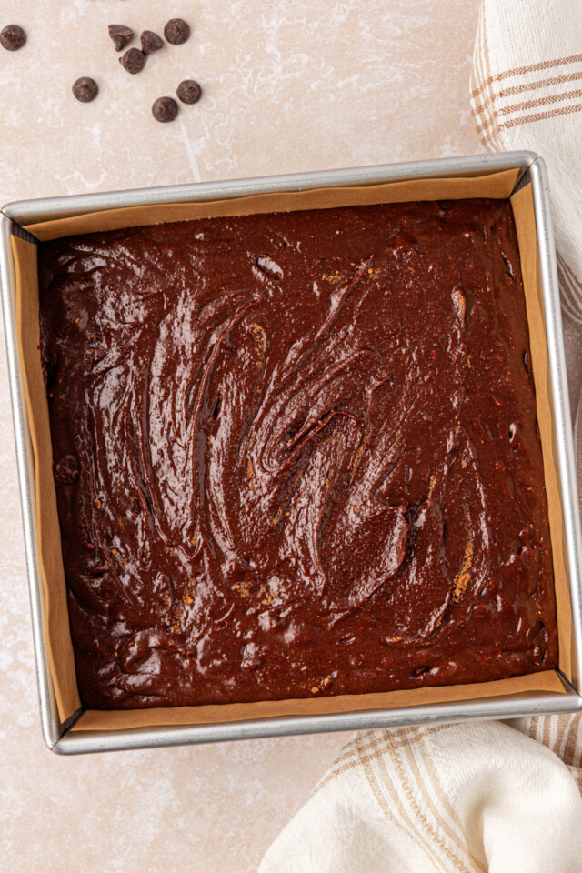 brown butter brownie batter in a baking pan before baking