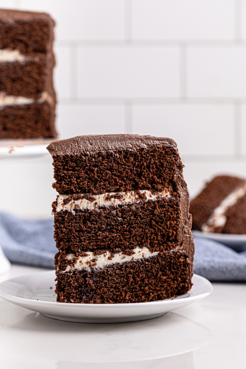 three-layer chocolate cake with cream cheese filling and chocolate frosting