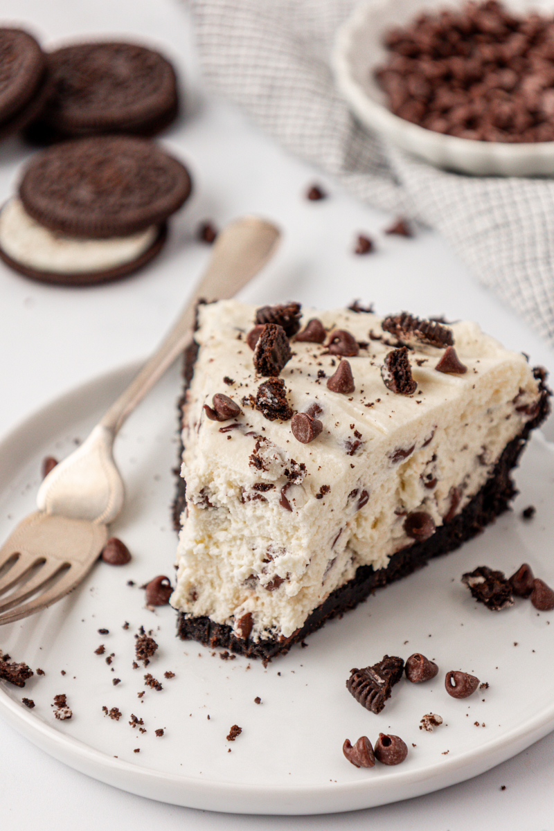 a slice of chocolate chip icebox pie with Oreo cookie crust