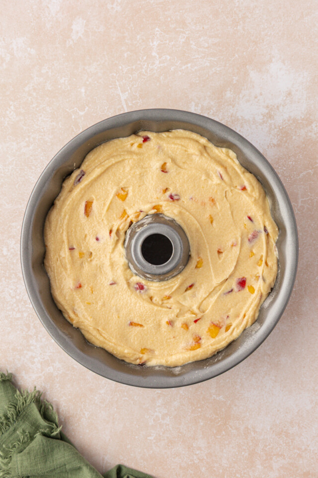 peach pound cake in a Bundt pan before baking