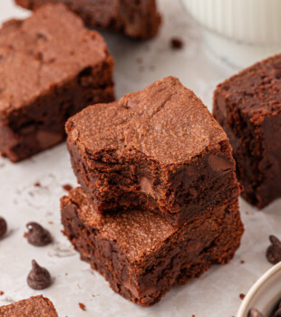 stack of two sour cream brownies with a bite missing from the top brownie