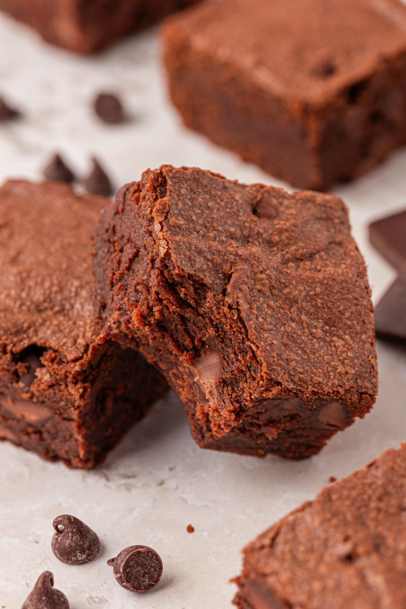 a sour cream brownie with a bite missing showing the not quite fudgy, not quite cakey texture