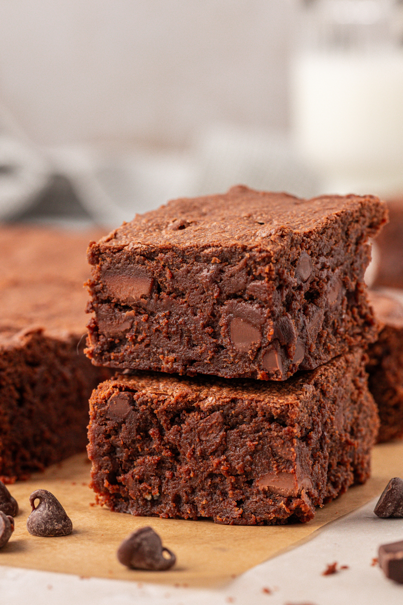 two stacked sour cream brownies filled with two kinds of chocolate chips