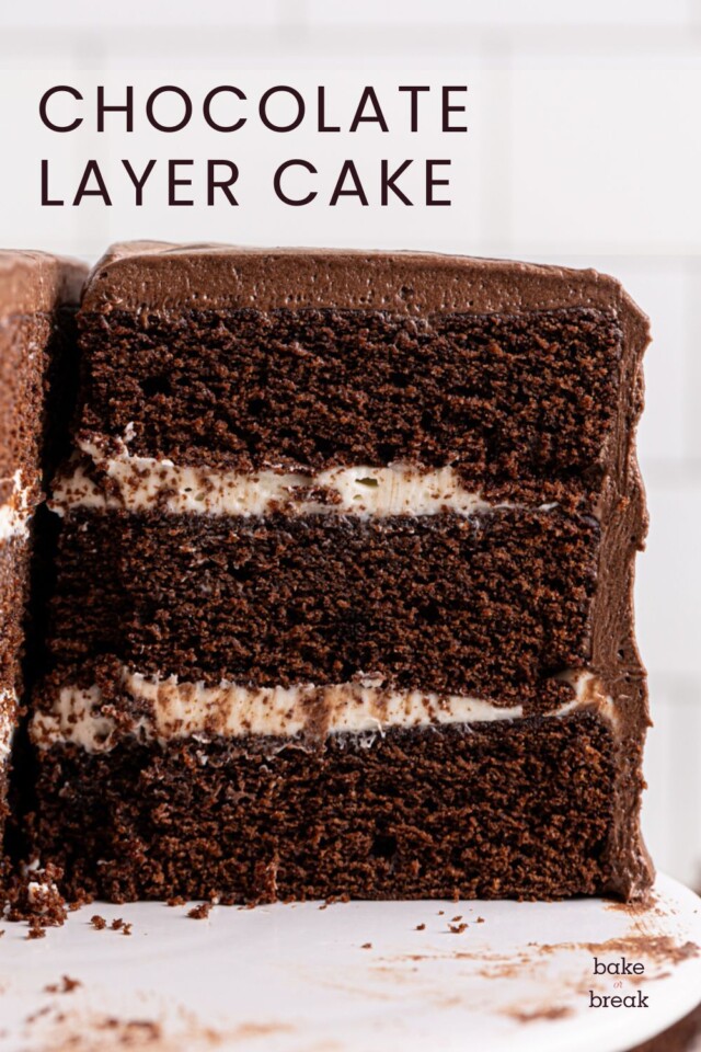 partially sliced chocolate layer cake with cream cheese filling and chocolate sour cream frosting; text overlay "chocolate layer cake"