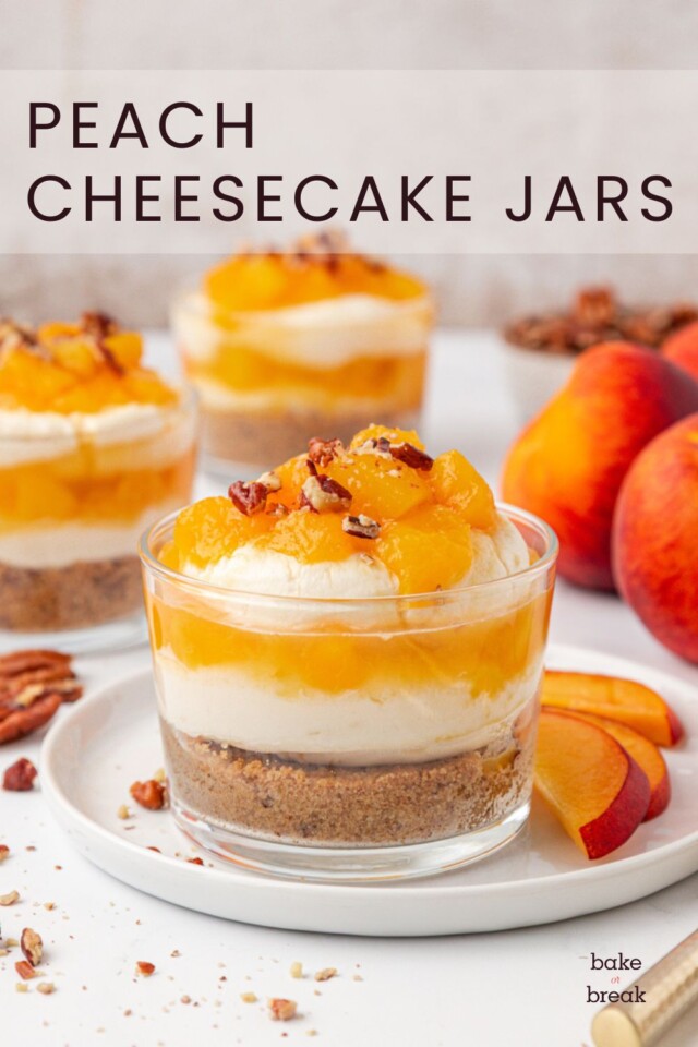 a peach cheesecake jar made with layers of nutty graham cracker crust, fluffy no-bake cheesecake filling, and fresh peach compote; text overlay "peach cheesecake jars"