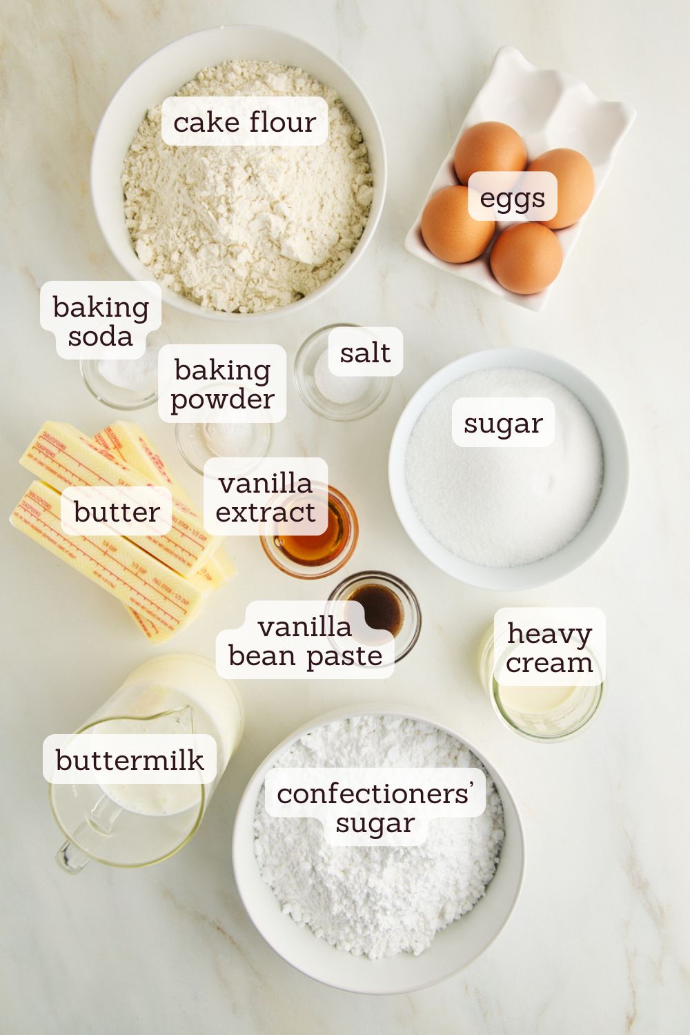 overhead view of ingredients for vanilla sheet cake with vanilla frosting