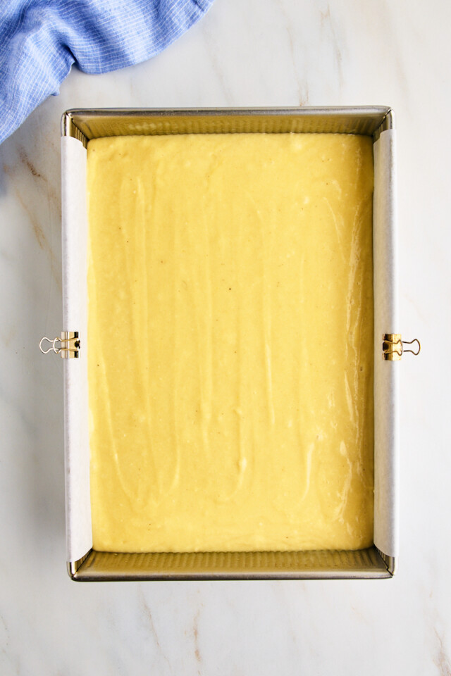 vanilla cake batter in a 9x13 pan before baking