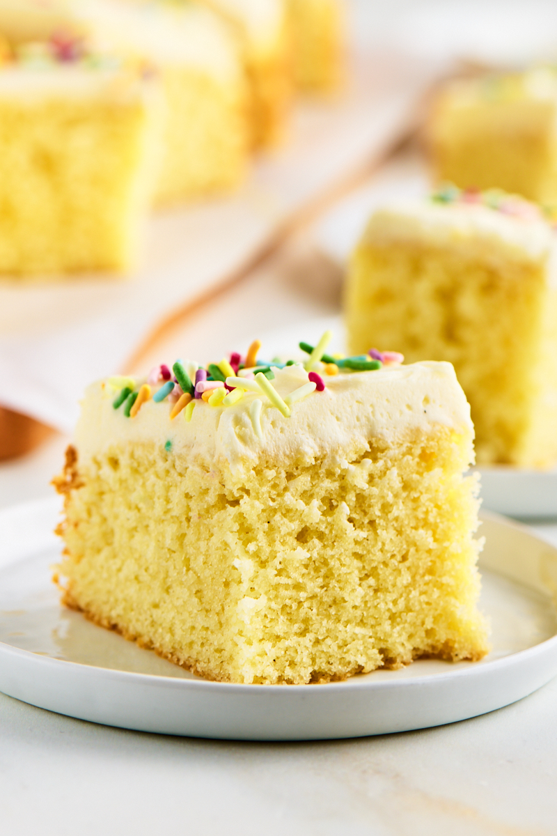 soft, moist vanilla sheet cake topped with vanilla buttercream frosting and rainbow sprinkles