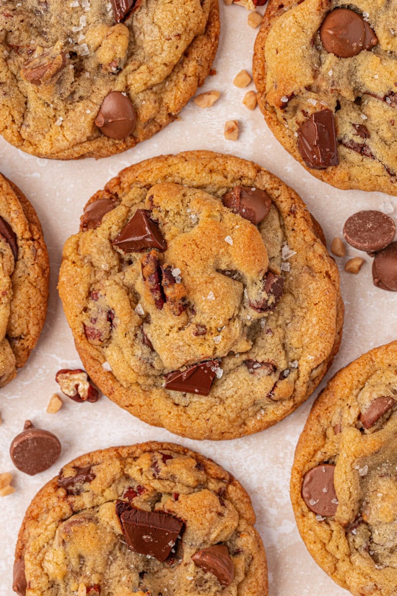 close-up of chocolate chip cookies loaded with two kinds of chocolate, toasted nuts, and toffee bits