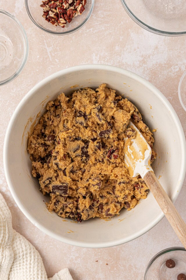 overhead view of loaded chocolate chip cookie dough in a mixing bowl