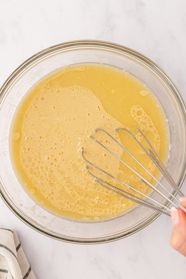 wet ingredients for muffins mixed in a glass bowl