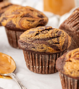 close up of a chocolate peanut butter muffin with a peanut butter swirl