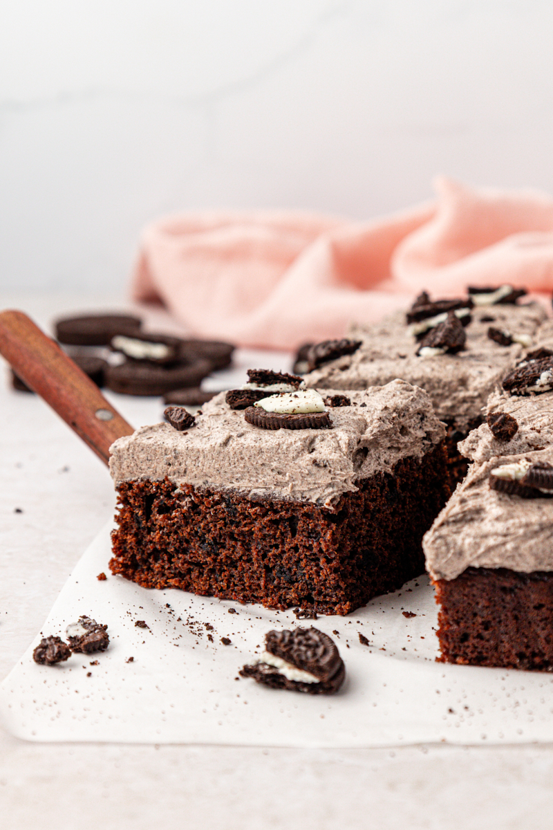 a slice of Oreo sheet cake with Oreo buttercream frosting