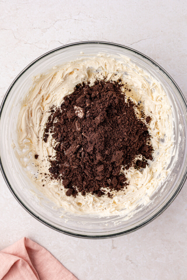 Oreo cookie pieces added to buttercream frosting
