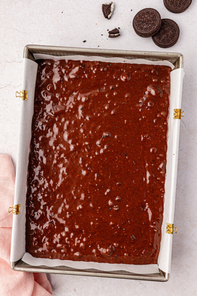 chocolate Oreo cake batter in a 9x13 pan before going into the oven