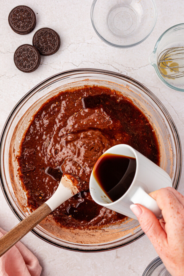 hot coffee being stirred into chocolate cake batter
