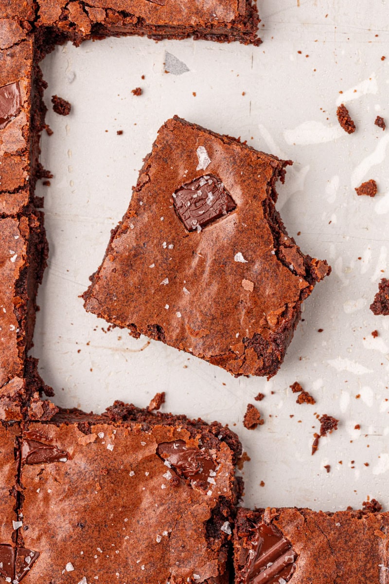 overhead view of a fudgy brownie with a bite missing
