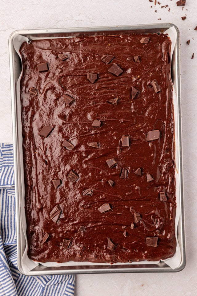 brownie batter spread in a sheet pan before baking