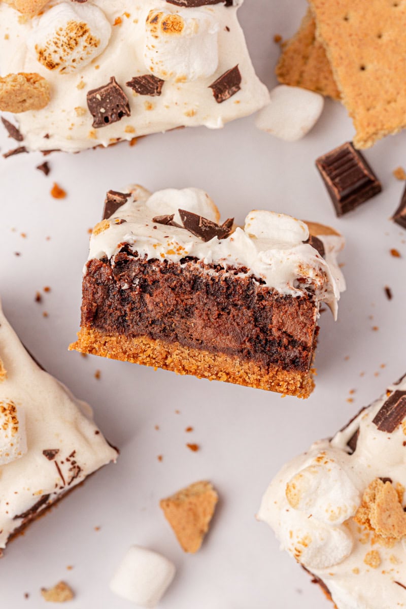 overhead view of a s'mores brownie showing the layers of graham cracker crust, fudgy brownies, and marshmallow frosting
