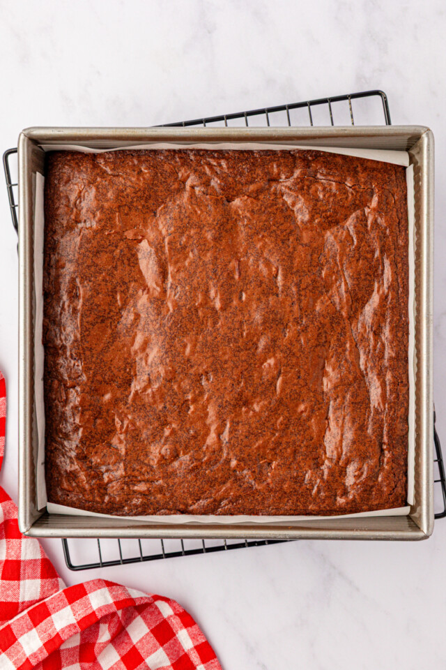 freshly baked brownies in a square metal baking pan