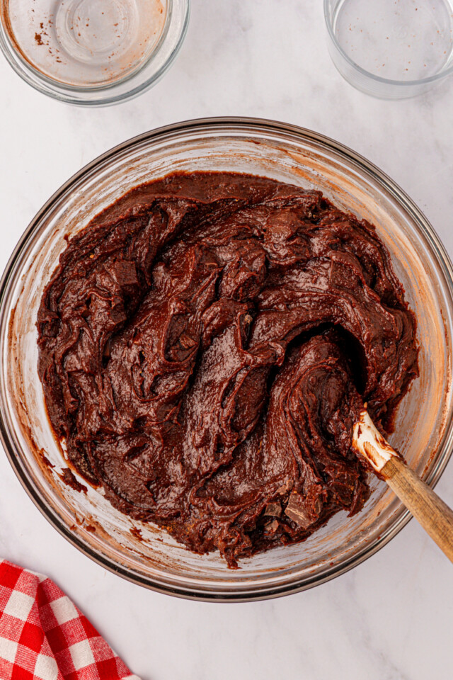 brownie batter in a glass mixing bowl