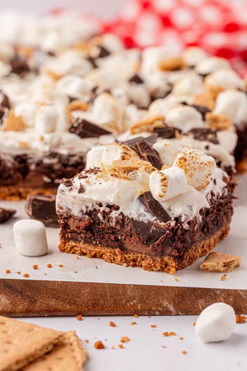 fudgy s'mores brownies with a graham cracker crust and marshmallow frosting
