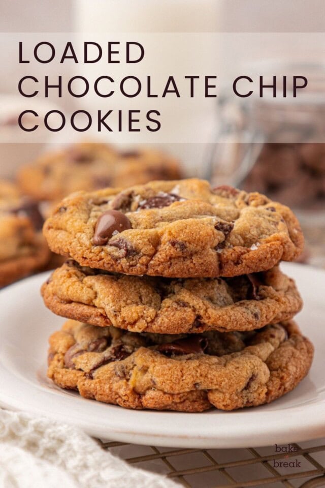 stack of three chocolate chip cookies with two kinds of chocolate, nuts, and toffee; text overlay "loaded chocolate chip cookies"