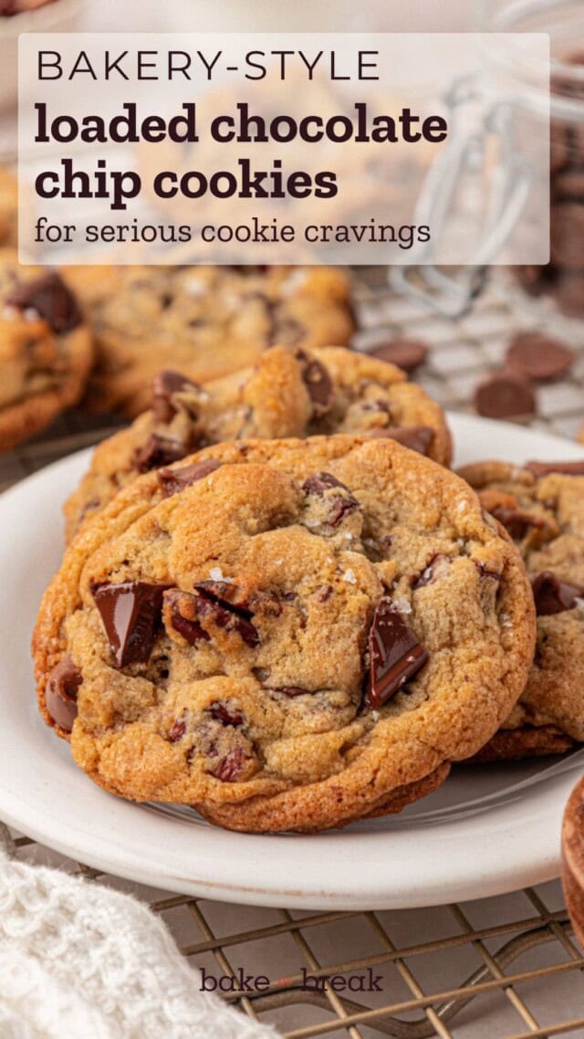 close up of a chocolate chip cookie filled with two kinds of chocolate, nuts, and toffee; text overlay "bakery-style loaded chocolate chip cookies for serious cookie cravings"