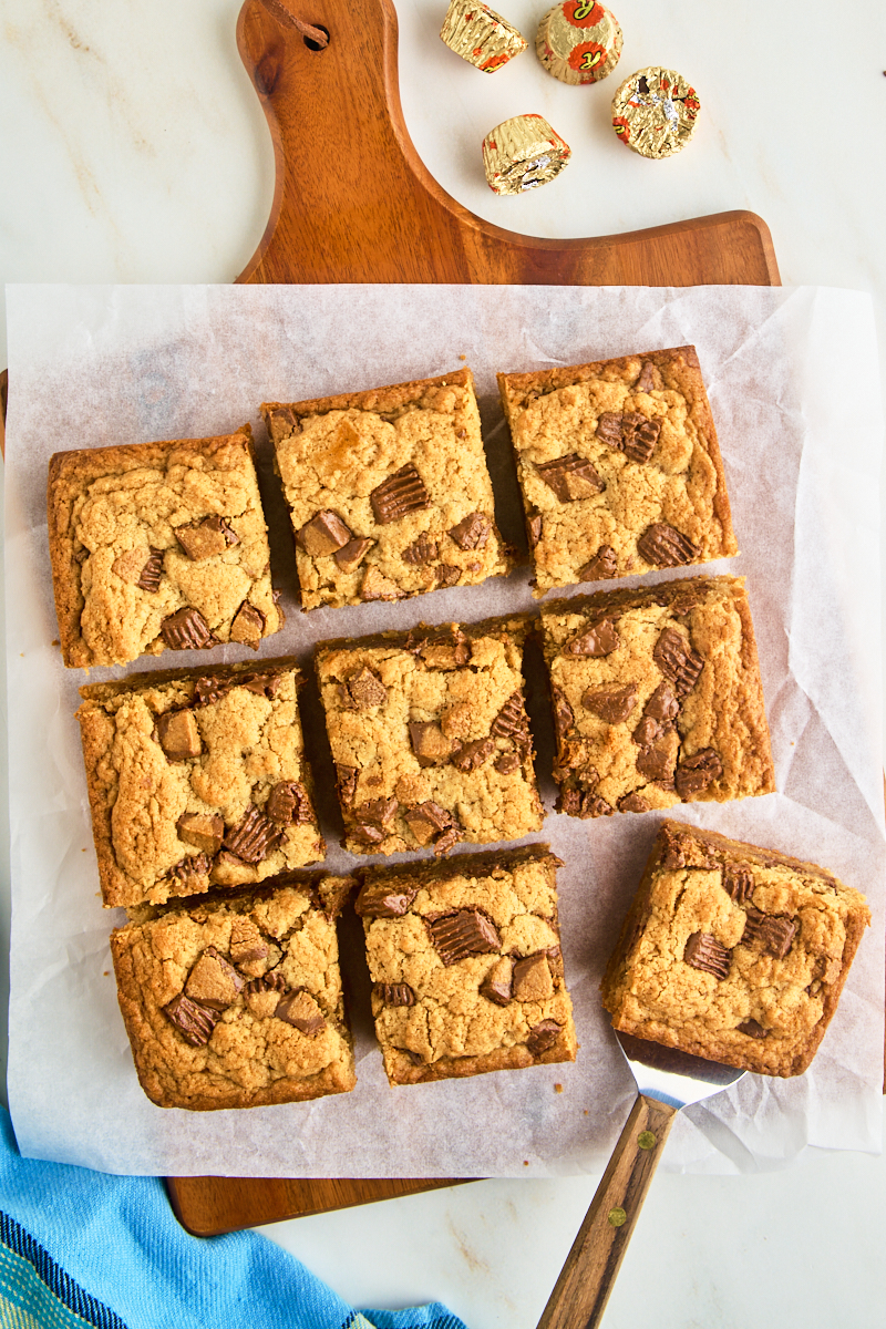 overhead view of sliced peanut butter blondies on parchment paper