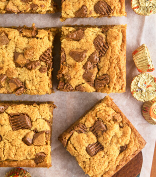 overhead view of sliced peanut butter cup blondies dotted with chopped peanut butter cups