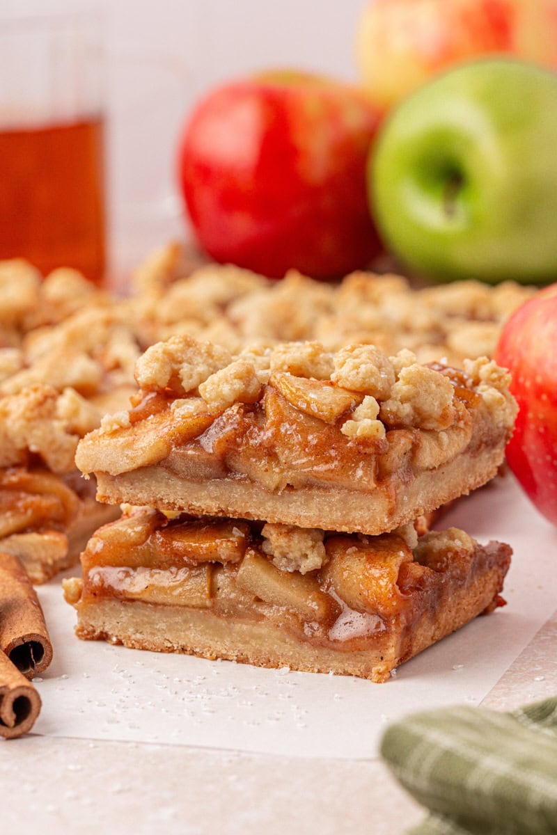 stack of two apple pie bars with thick, buttery crust and crumb topping