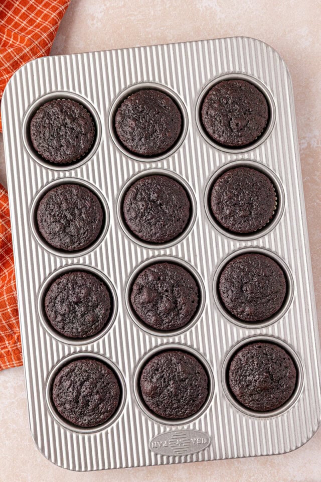 freshly baked chocolate cupcakes in a muffin pan