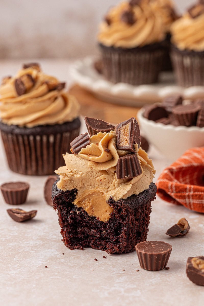 cut-open chocolate cupcake with peanut butter filling and frosting