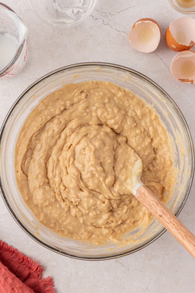 cinnamon muffin cake batter in a glass mixing bowl