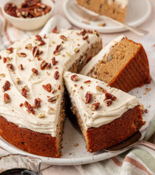 partially sliced maple snack cake with maple buttercream frosting