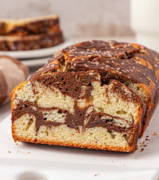 sliced marble loaf cake showing the chocolate and vanilla swirl pattern