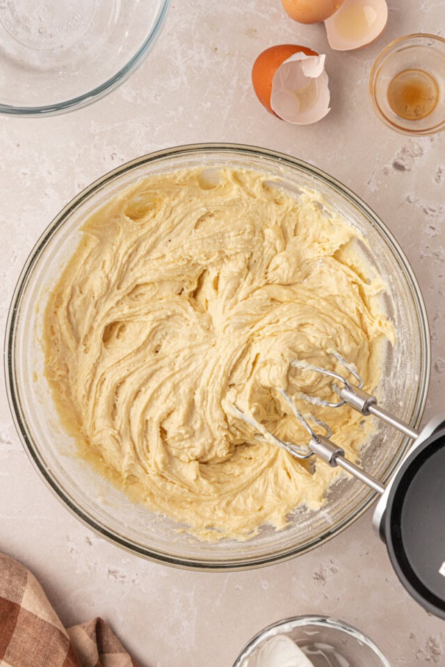 overhead view of vanilla cake batter in a mixing bowl