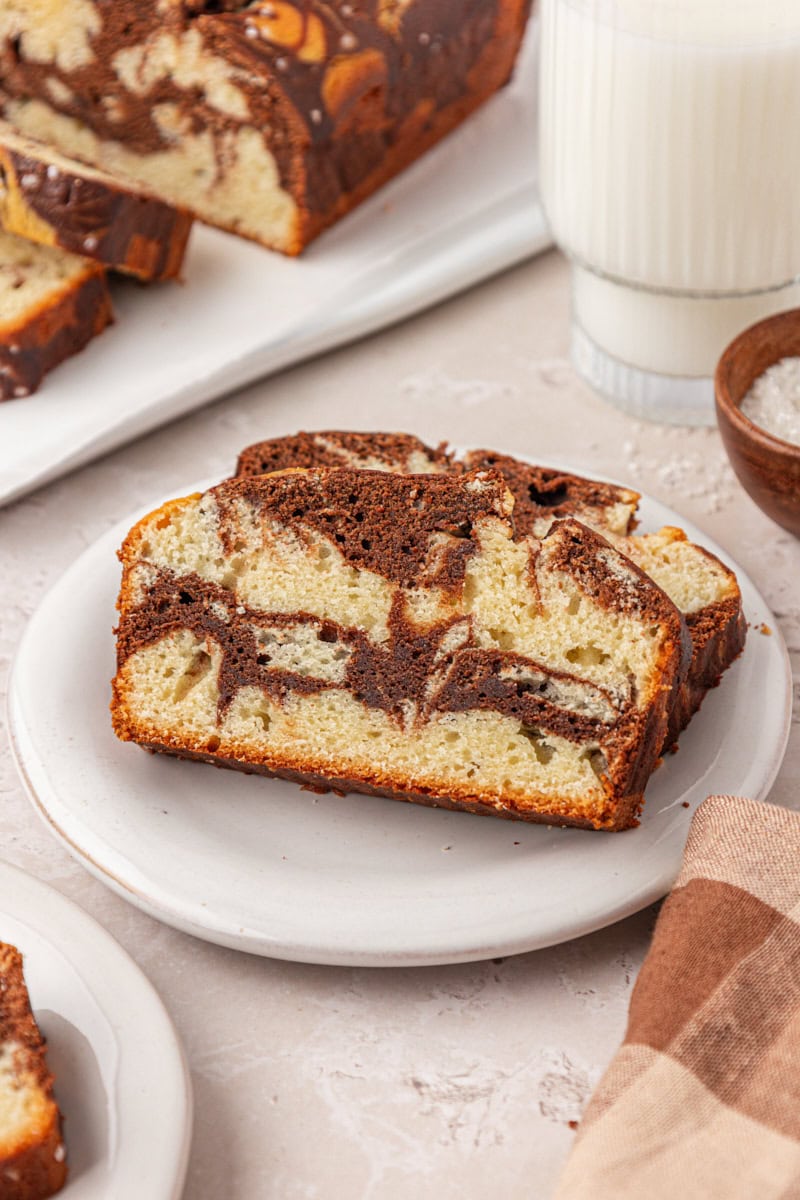 two slices of marble loaf cake on a white plate