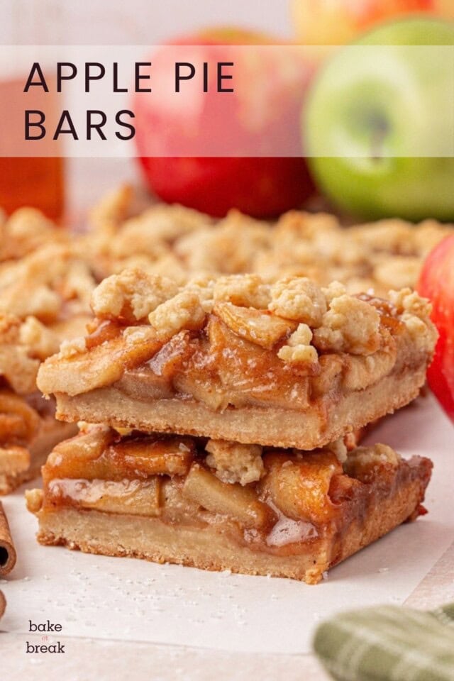 stack of two apple pie bars with crumb topping; text overlay "apple pie bars"