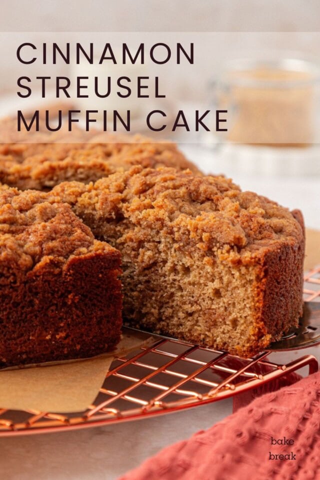 a slice of cinnamon streusel muffin cake being removed from the remaining cake; text overlay "cinnamon streusel muffin cake"