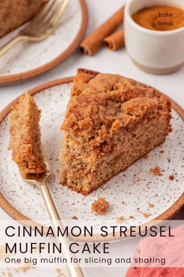 a slice of cinnamon streusel muffin cake showing the soft cake crumb and brown sugar streusel; text overlay "cinnamon streusel muffin cake - one big muffin for slicing and sharing"