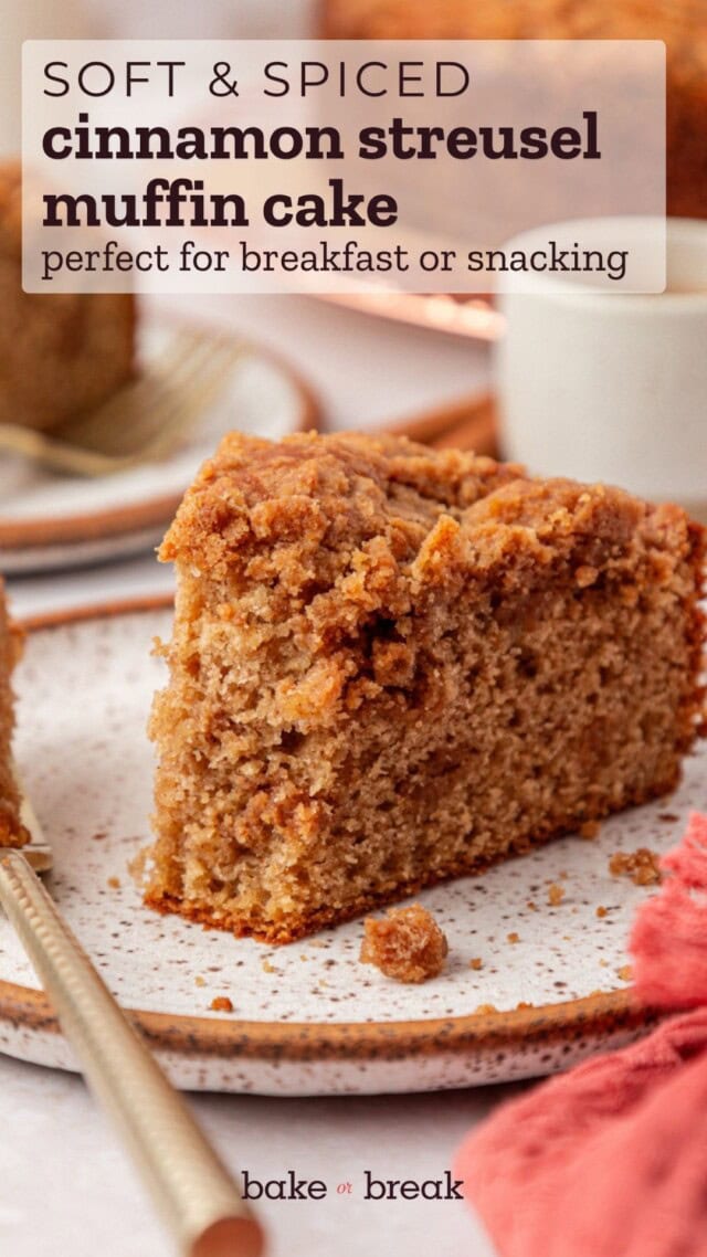 close-up of a slice of cinnamon muffin cake with a streusel layer inside and on top; text overlay "soft & spiced cinnamon streusel muffin cake - perfect for breakfast or snacking"