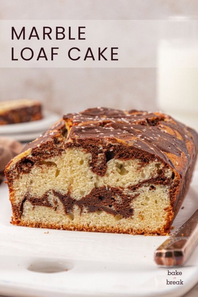cross section of marble loaf cake showing the vanilla and chocolate cake swirls; text overlay "marble loaf cake"