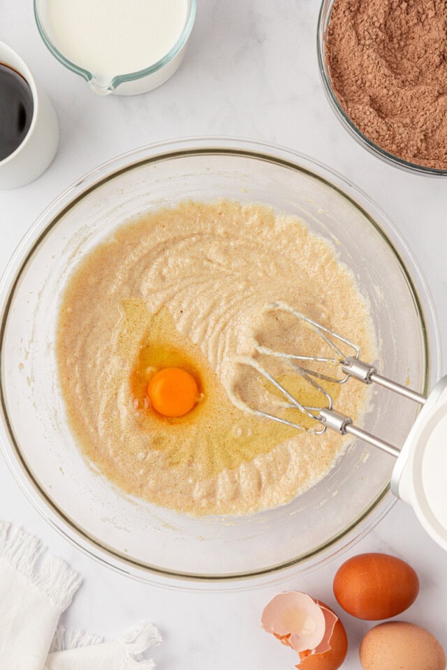 egg added to combined butter, sugar, and oil in a mixing bowl