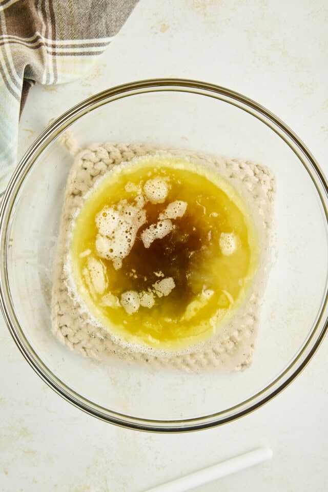 overhead view of cooled, partially solidified browned butter in a mixing bowl